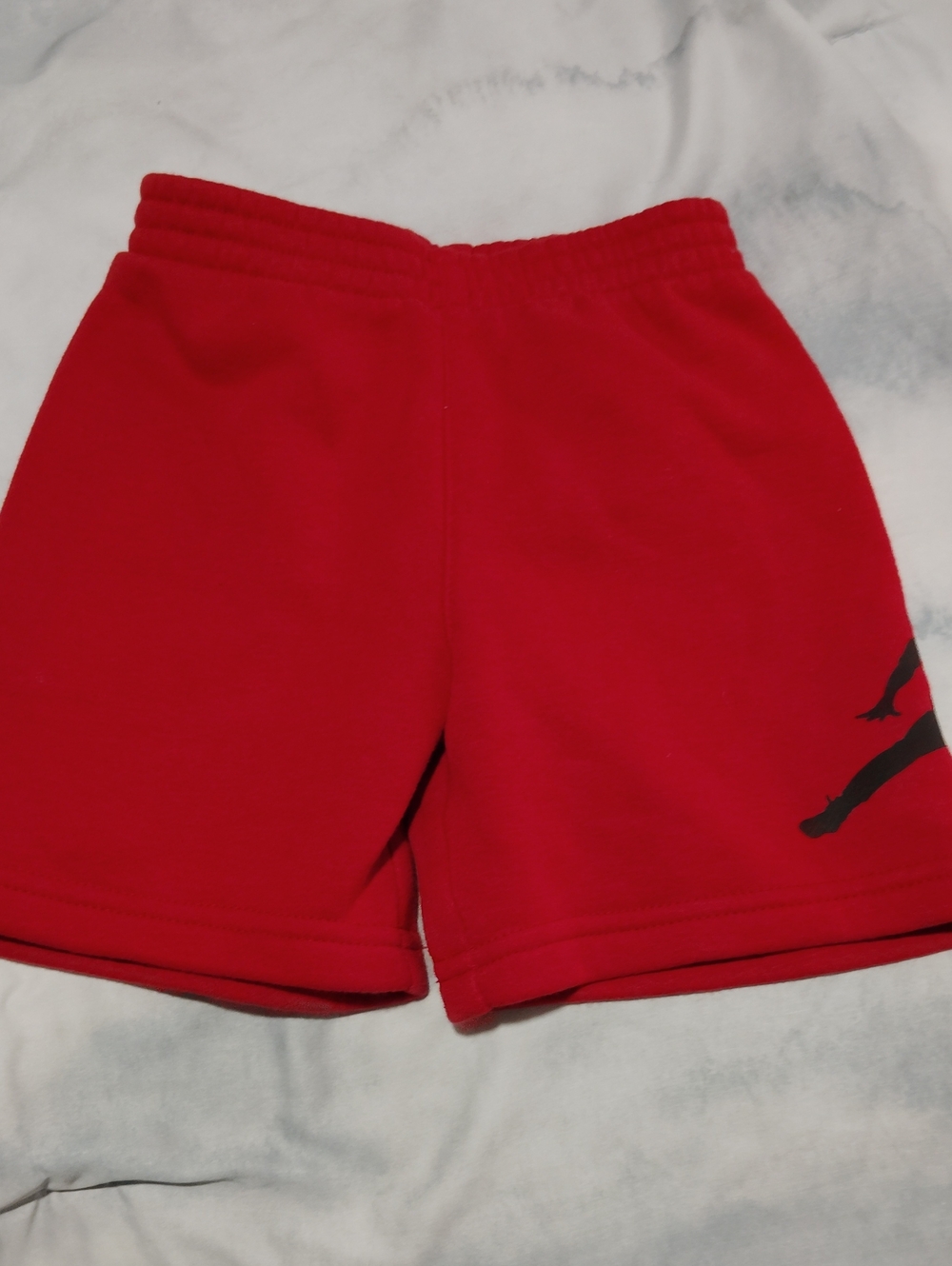 Nike Kids Red Shorts with Black Swoosh Detail